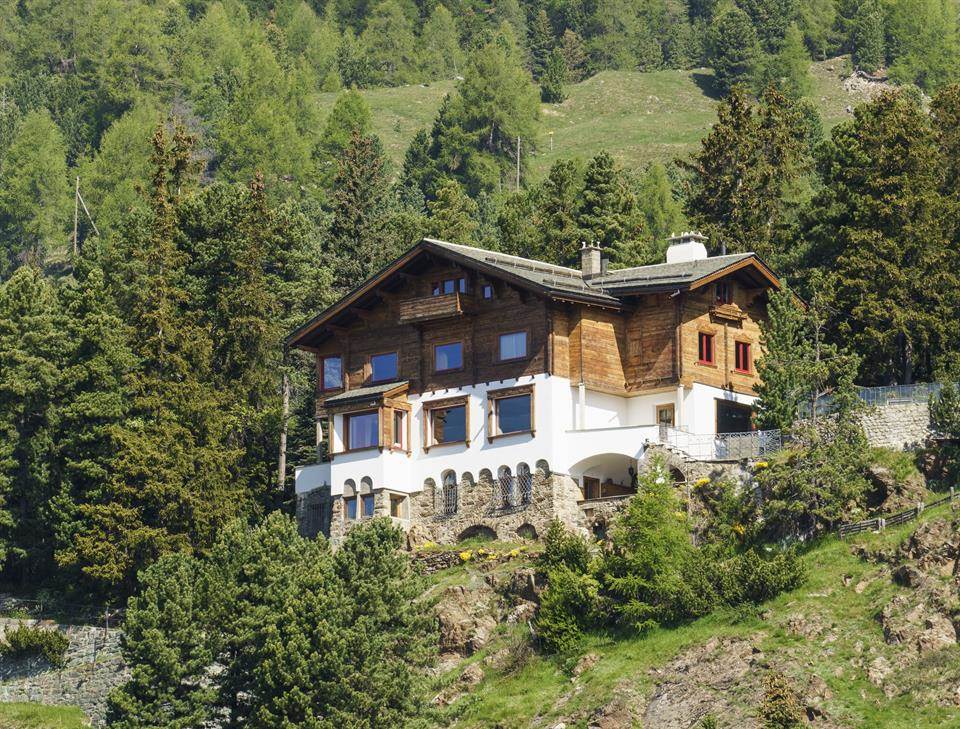 Chalet sul Spelm is a spectacular Alpine retreat in the upper Engadine Valley, a few minutes walk from the village of St. Moritz. The elegant home features 600 square meters of living spaces across four floors, 10 bedrooms, as well as a separate guest apartment.