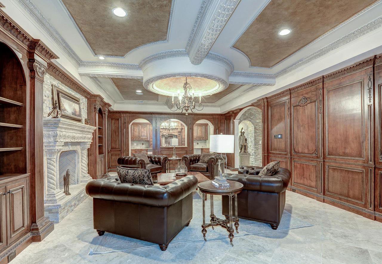 This eight-bedroom home in McLean, Virginia, offers an array of experiential amenities for the luxury connoisseur: a cigar room, wine cellar, billiards room, mahogany-paneled library, and plush cinema.