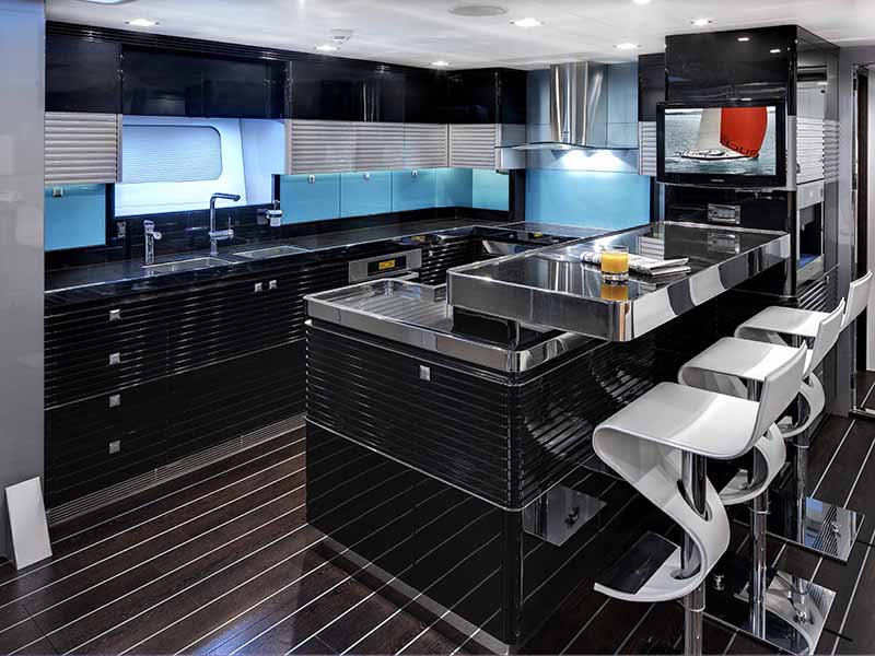 Features incorporated by Design Unlimited on the ultramodern Bliss superyacht include a stylish and well-equipped galley with breakfast bar.