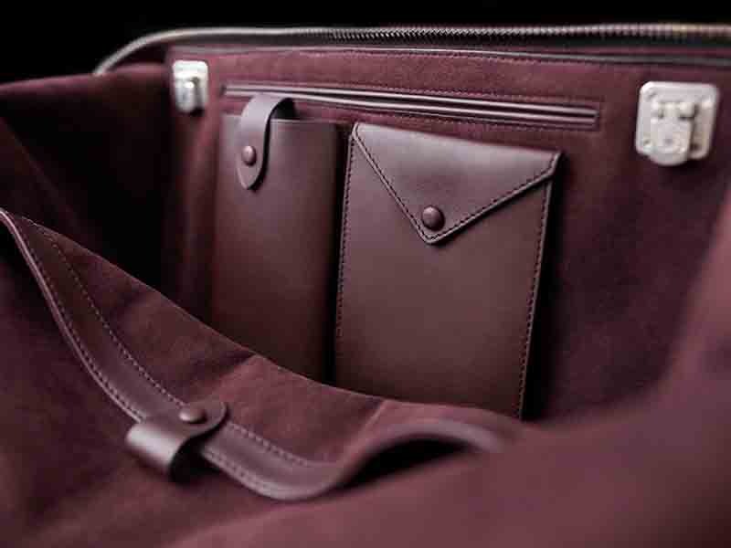The interior linings of LONB’s bags are made from Alcantara in its house color: amarone.