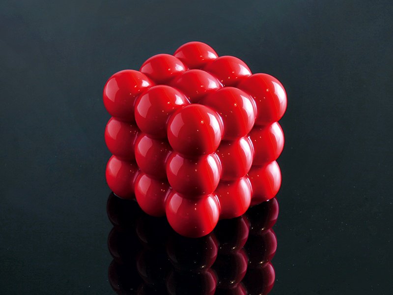 The “3x3x3” mold creates a geometric dessert—hard to believe it contains pistachio sponge cake, raspberry mousse, raspberry cream, and confit raspberry. Photograph: Dinara Kasko