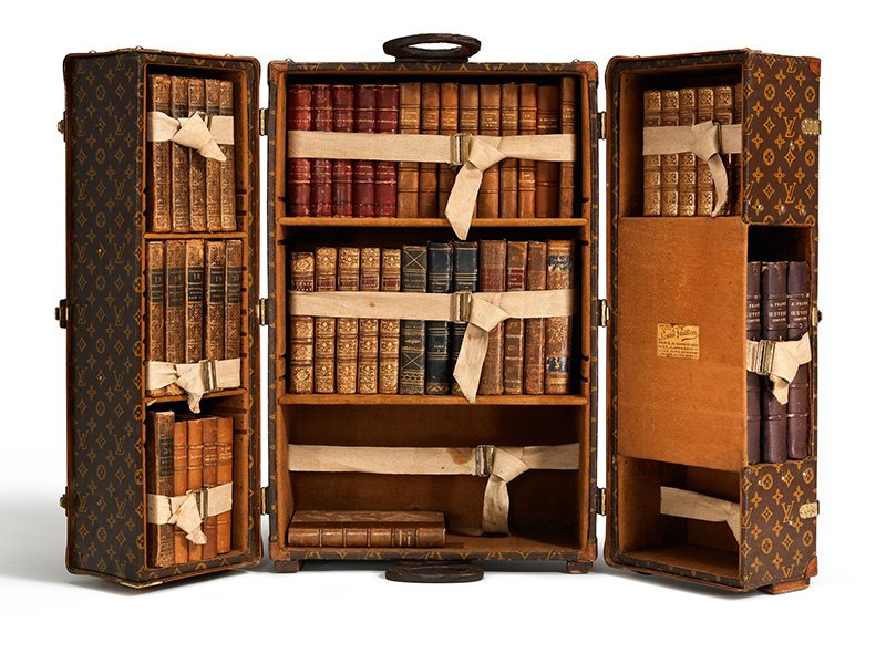 The Louis Vuitton library trunk, created in Paris in 1923 for author Ernest Hemingway, could be packed tight with books, with drawers for stationery, notebooks, and pens.