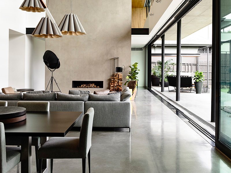 In Concrete House in Melbourne, Australia, by Matt Gibson Architecture, carefully curated furniture and lighting set off the sheen of polished concrete floors and kitchen surfaces. It’s the material at its most elegant, and illustrates the primary way concrete is slotting into luxury residential design. Photograph: Derek Swalwell