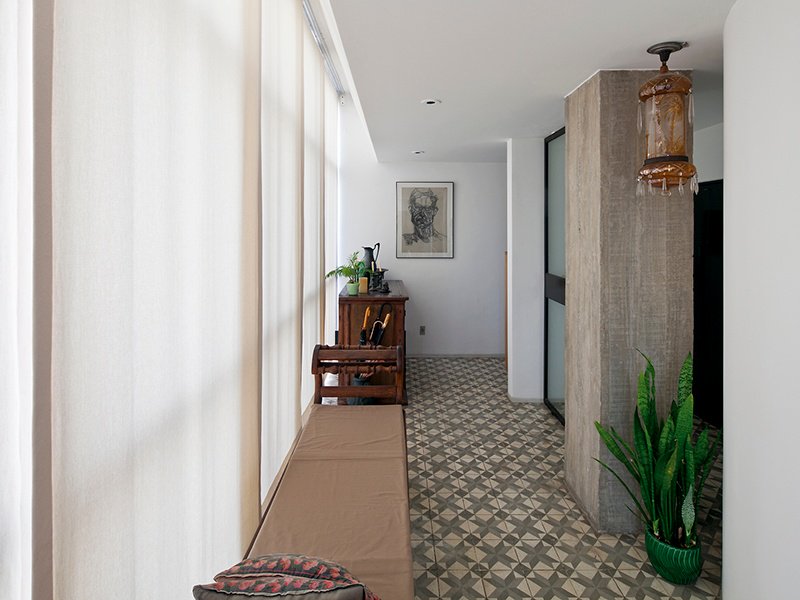 Located in the Sumaré neighborhood of São Paulo, Brazil, this spectacular penthouse apartment was designed by renowned Brazilian architect Paulo Mendes da Rocha, with the concrete features complementing the tiled floors. Large windows provide naturally bright spaces and a superior view of the city.