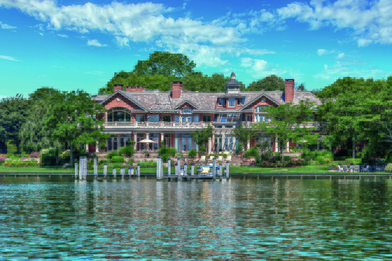 The house stands in a private spot on nearly three acres, which includes 240 feet of waterfront.