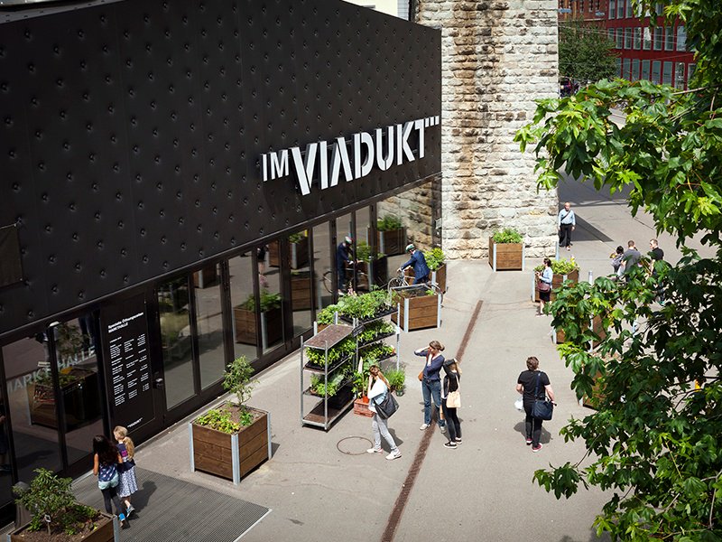 A mix of cafés, studio galleries, and sport and fashion boutiques are nestled under the IM VIADUKT railway arches in Zürich-West, with an expansive food market at its heart. Photograph: Nelly Rodriguez