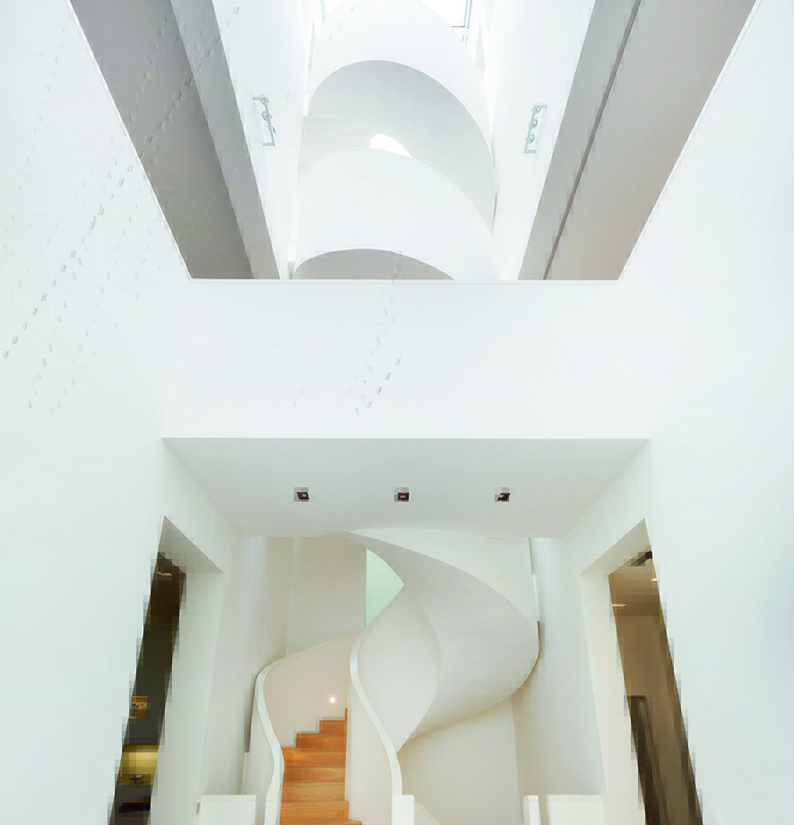 Taking center stage is the much-admired 100-foot staircase, twisting like a helix upwards to the other floors.