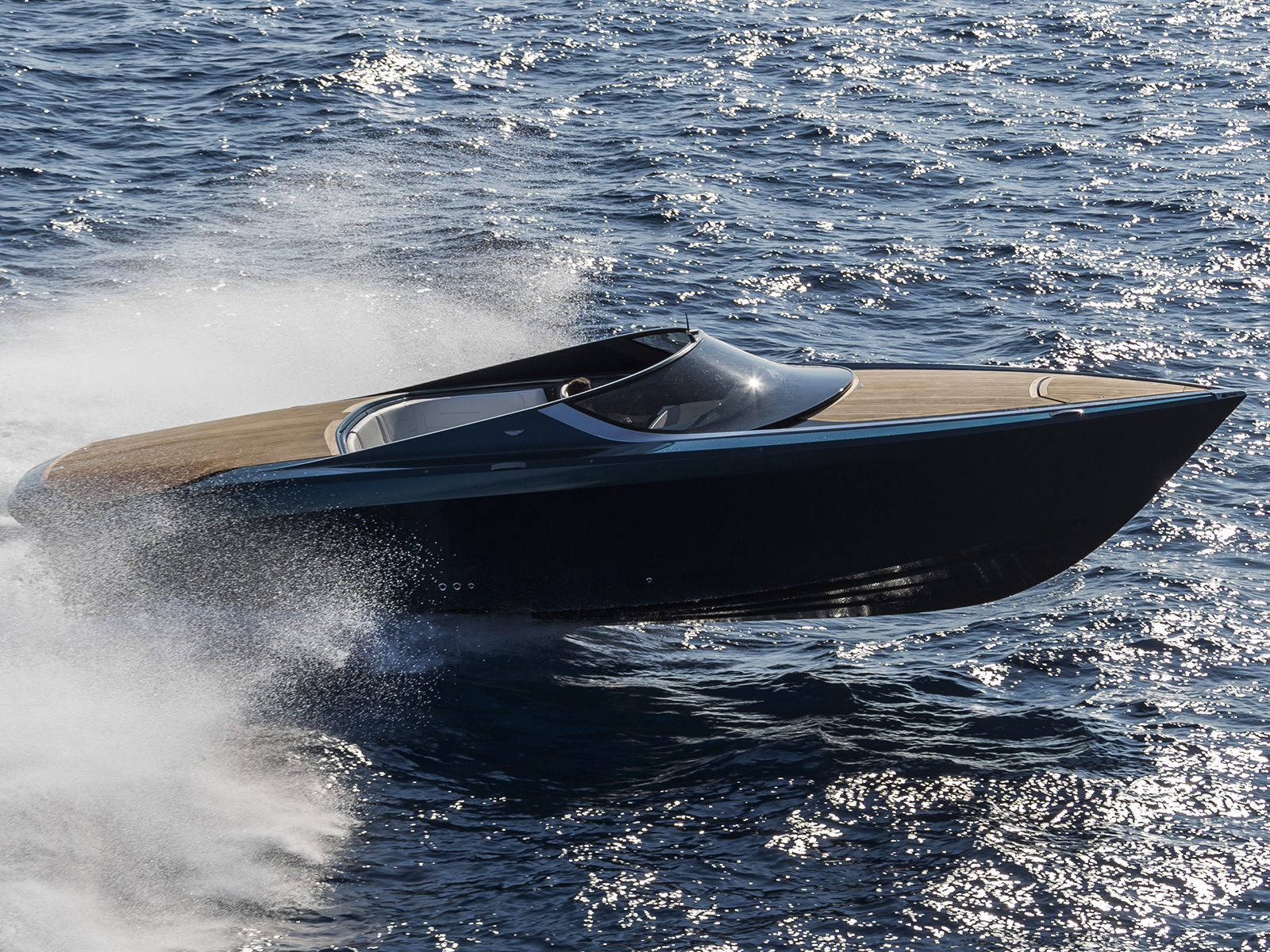 The Aston Martin AM 37 powerboat cuts through the water