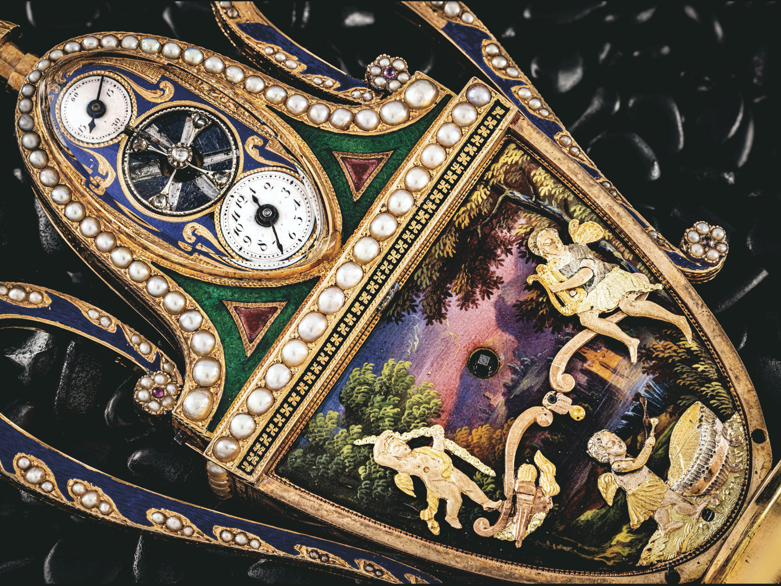 A highly decorated enamel table watch