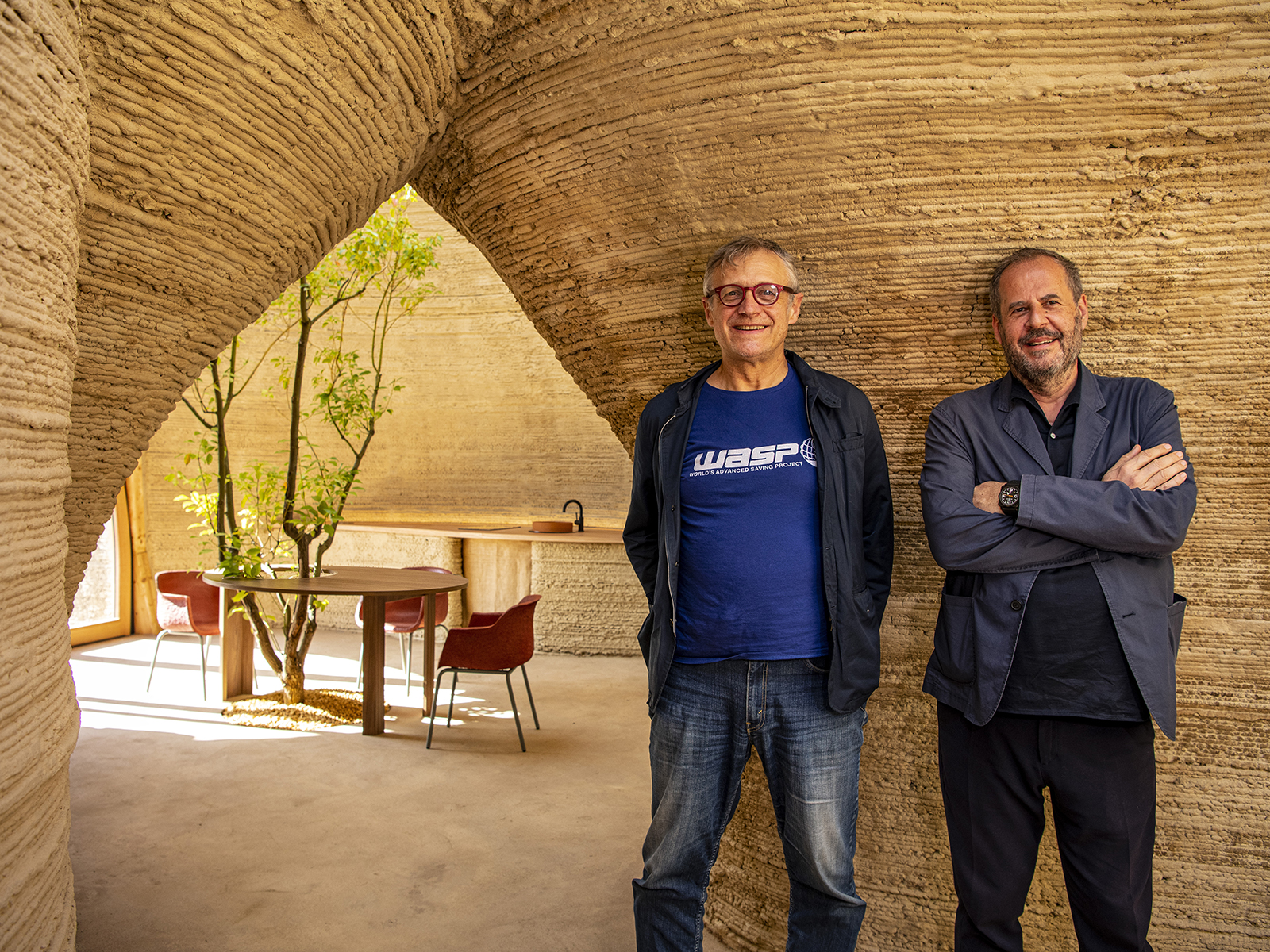 Massimo Moretti and Mario Cucinella inside one of their sustainable houses created using 3D architecture printing