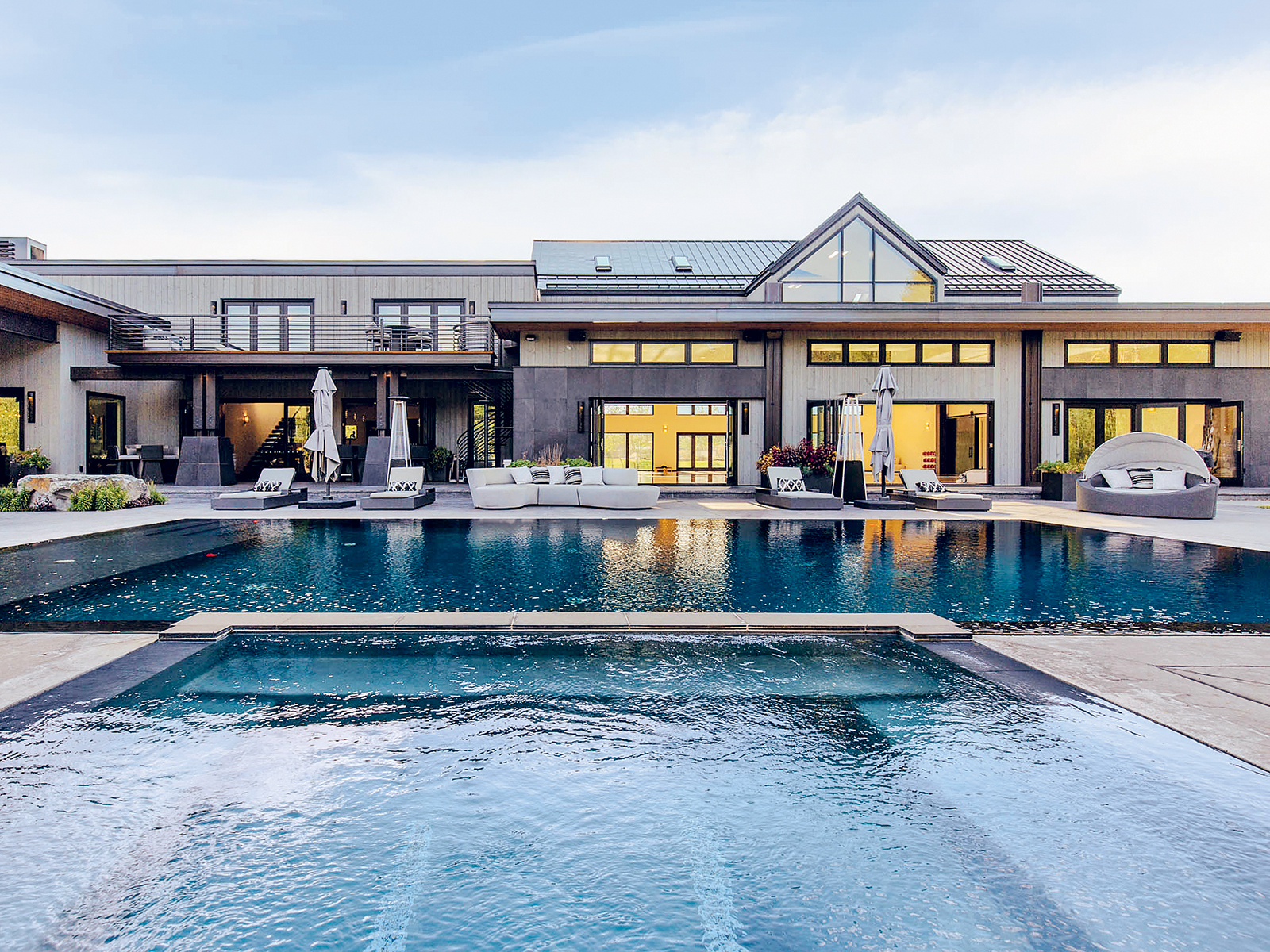 A vast outdoor pool is one of the water features at this Montana home