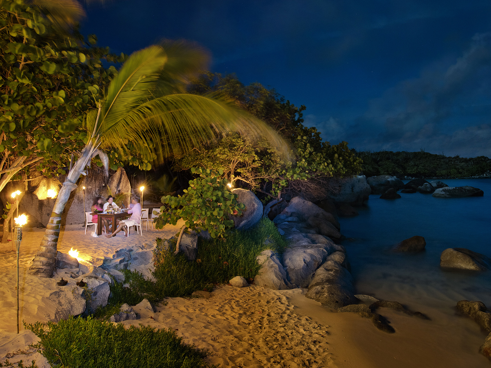 Secluded dining on the beach at night