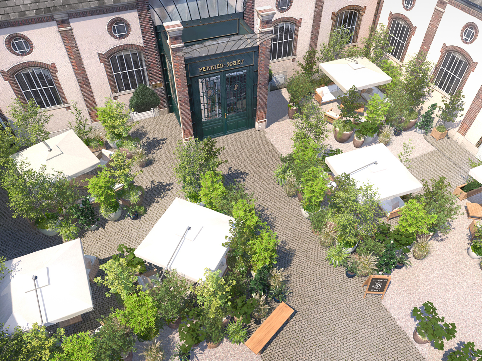 Belle Époque Cellier's outdoor terrace shot from the air featuring shaded tables and greenery