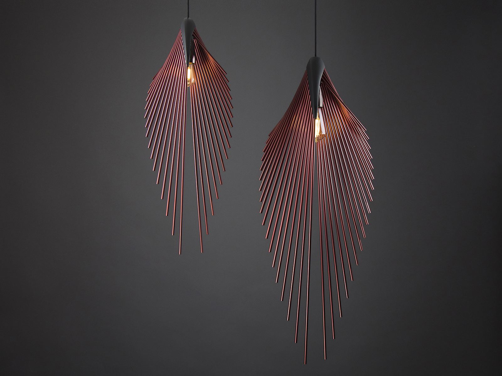 Two hanging lights in pale red set against a dark gray background